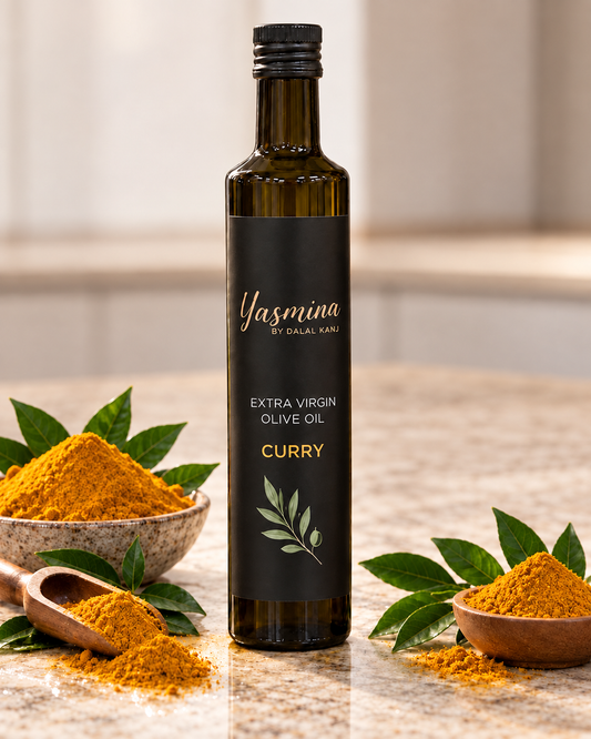 Yasmina by Dalal Kanj certified organic extra virgin olive oil with curry, dark glass bottle surrounded by turmeric curry powder and olive branch